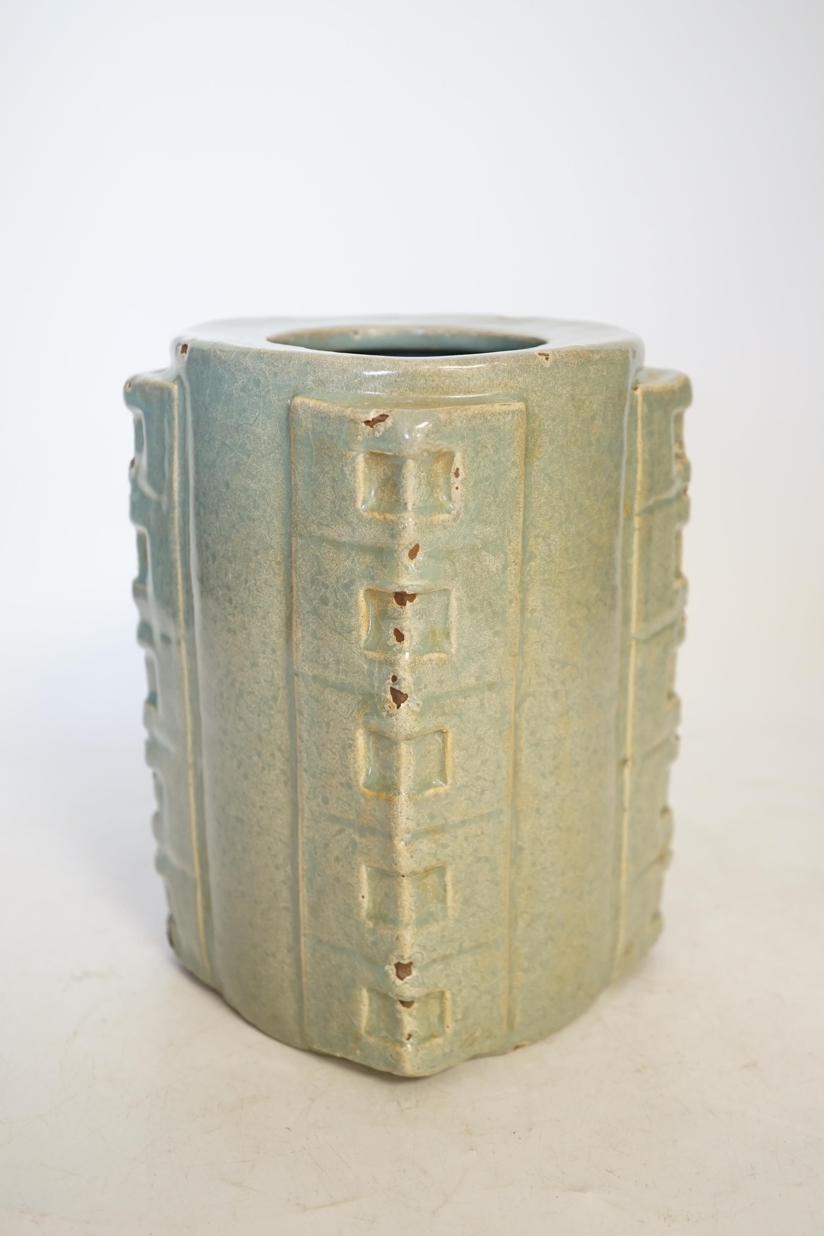 A Chinese celadon glazed cong jar, 18cm high. Condition - poor to fair, some chipping